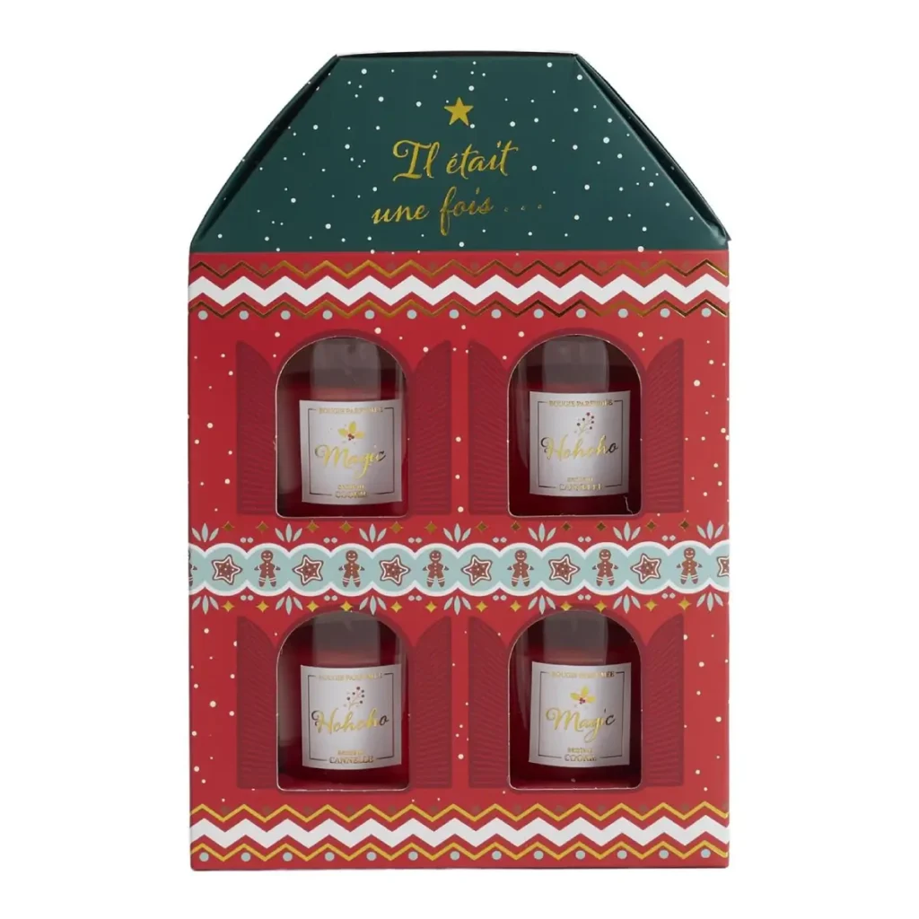 Geopende kerst geurkaarsenset met rode kaarsen in luxe doos